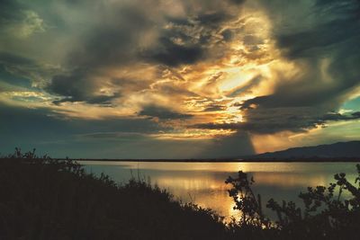 Scenic view of sea against cloudy sky