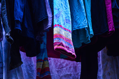 Close-up of clothes hanging in store