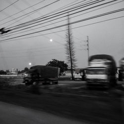Blurred motion of cars on road at dusk
