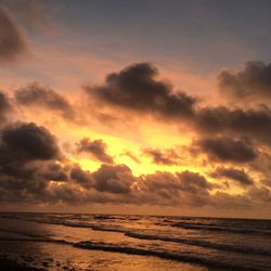 Scenic view of sea against cloudy sky