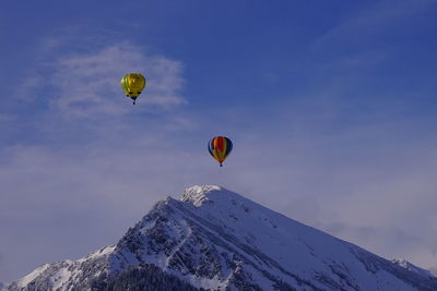 Low angle view of hot air balloons against sky