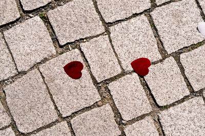 High angle view of heart shape on footpath