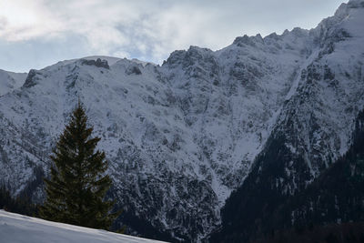 Scenic view of snowcapped mountains against sky