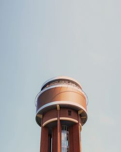 Low angle view of water tower against clear sky