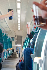 Low section of man sitting in airplane