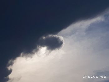 Low angle view of sign against sky