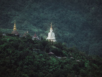 Statue of temple against building