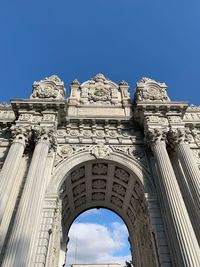 Low angle view of historical building against blue sky