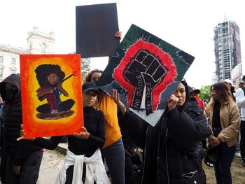 Group of people against building in city