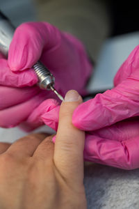 Cropped hand of doctor holding syringe