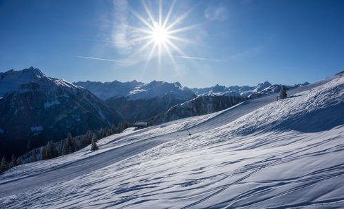 Scenic view of snow covered mountains against sky in montafon