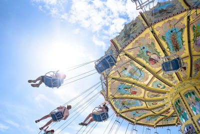 Low angle view of amusement park ride against sky