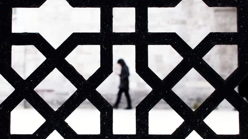 Full frame shot of person standing on fence