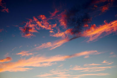 Low angle view of cloudy sky at sunset