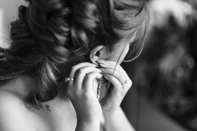 Close-up of woman wearing earrings