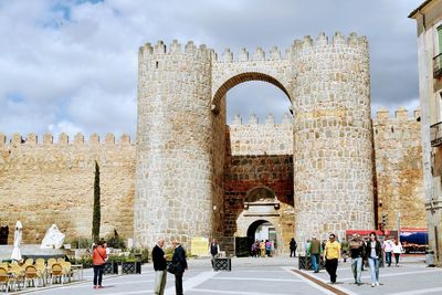 Group of people in front of historical building