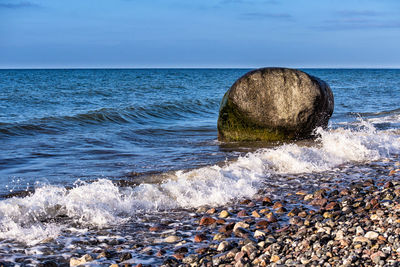 Close-up of wave in sea against sky