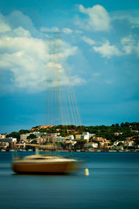 Scenic view of sea against sky in city