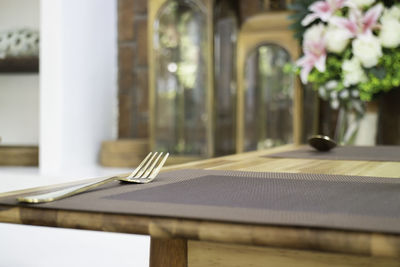 Close-up of open book on table in restaurant