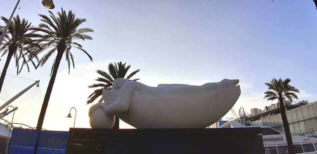 LOW ANGLE VIEW OF STATUE OF PALM TREE AGAINST CLEAR SKY