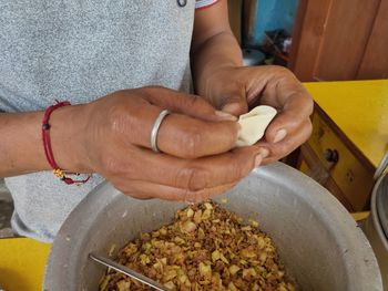 Close-up of man preparing food