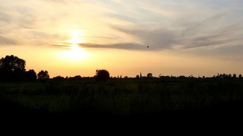 Scenic view of silhouette landscape against sky during sunset