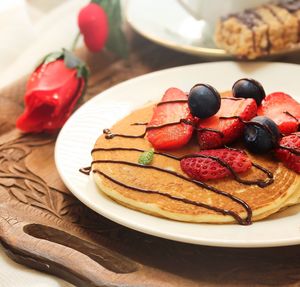 Close-up of pancake on plate on table