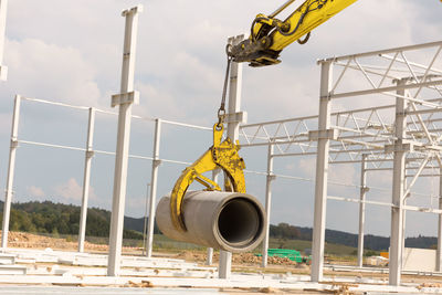 Low angle view of construction site against sky