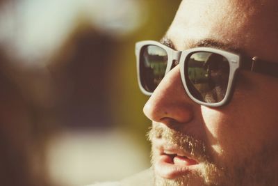 Close-up of man wearing sunglasses outdoors