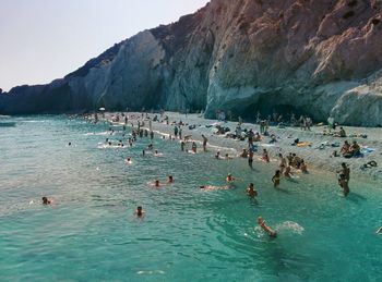 People swimming in sea