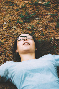 Portrait of young woman lying down