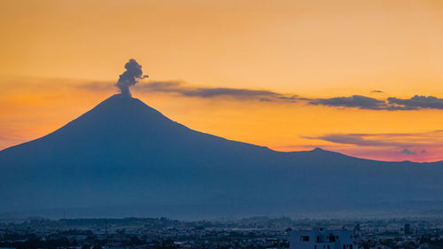 Scenic view of mountains against sky during sunset