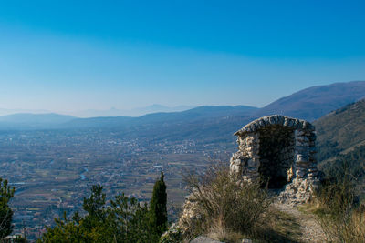 Panoramic view of city against blue sky