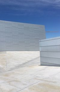 White building against blue sky on sunny day