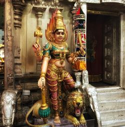 Buddha statue in temple outside building