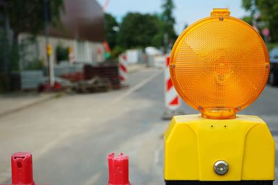 Close-up of yellow traffic on road