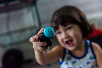 Portrait of a girl holding camera