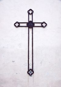 Close-up of cross on wall