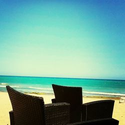 Scenic view of sea against blue sky