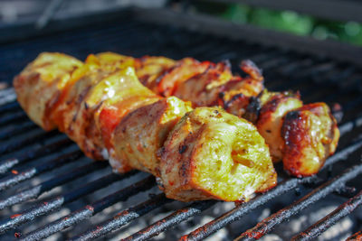 High angle view of meat on barbecue grill