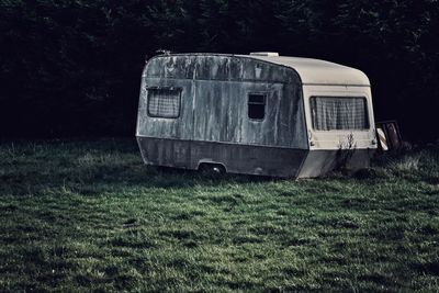 Abandoned car on field