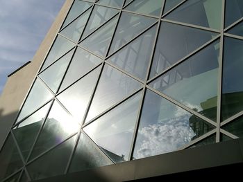 Low angle view of building against cloudy sky