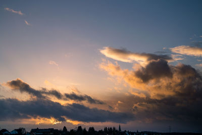 Low angle view of dramatic sky during sunset