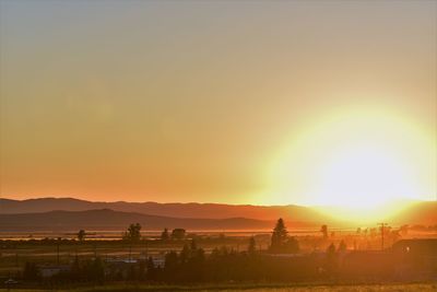 Scenic view of landscape against sky during sunset