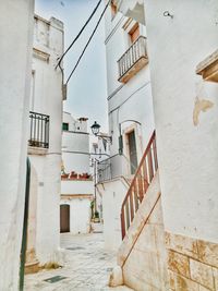 Alley amidst buildings in city