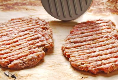 Close-up of pork on wooden table