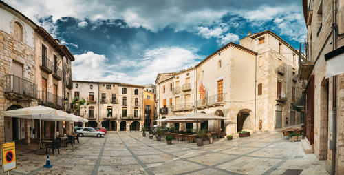 Buildings in city against sky