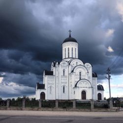 Exterior of church against cloudy sky