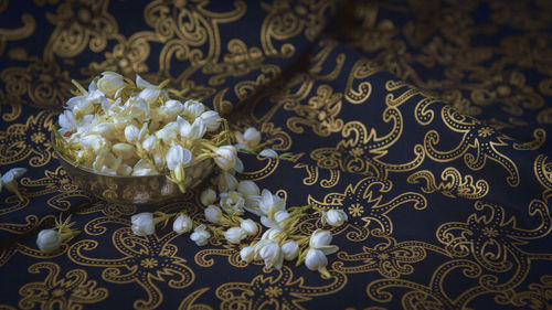 High angle view of white flowers on table