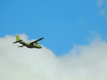 Low angle view of airplane against sky